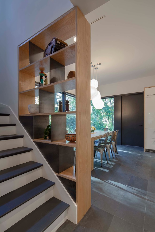 Photo of a modern wood straight staircase in Boston with wood risers.