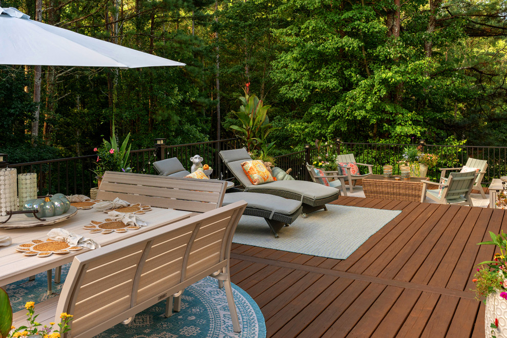 Example of a transitional backyard second story metal railing deck design in Atlanta with a bbq area and no cover