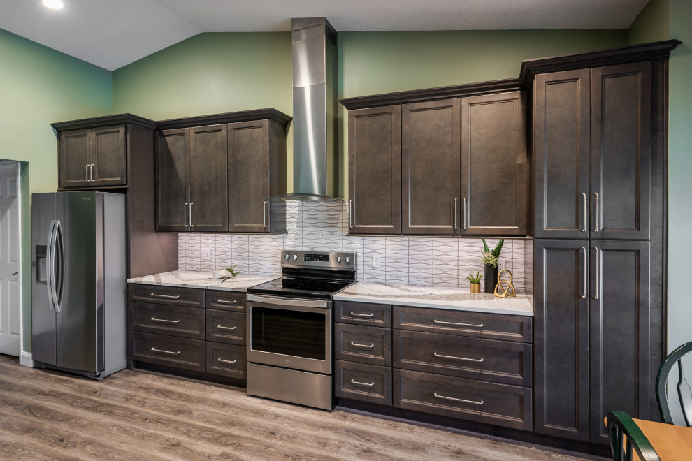 Inspiration for a huge transitional single-wall vinyl floor and gray floor eat-in kitchen remodel in Orlando with an undermount sink, recessed-panel cabinets, gray cabinets, quartz countertops, white backsplash, porcelain backsplash, stainless steel appliances, an island and white countertops