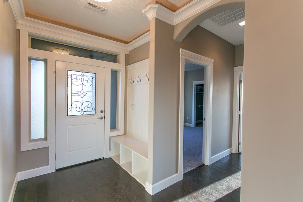 Inspiration for a small transitional dark wood floor front door remodel in Seattle with gray walls and a white front door