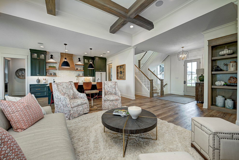 Inspiration for a mid-sized transitional open concept living room in Indianapolis with white walls, vinyl floors, a standard fireplace, a tile fireplace surround, brown floor and exposed beam.
