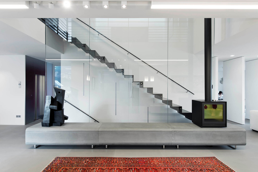 Photo of a contemporary metal straight staircase in Other with metal risers.