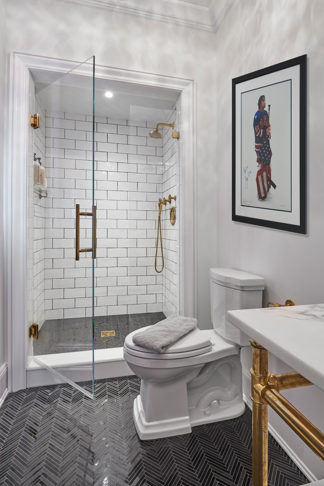 Inspiration for a transitional bathroom in New York with a corner shower, marble floors, an undermount sink, marble benchtops and a hinged shower door.