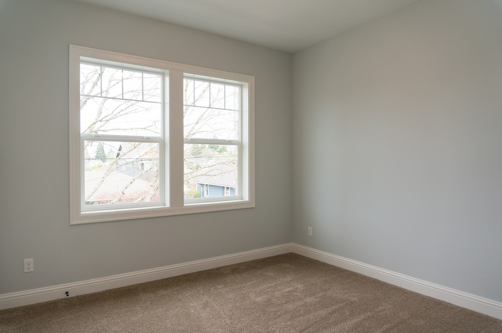 Mid-sized arts and crafts guest bedroom in Portland with grey walls, carpet and no fireplace.