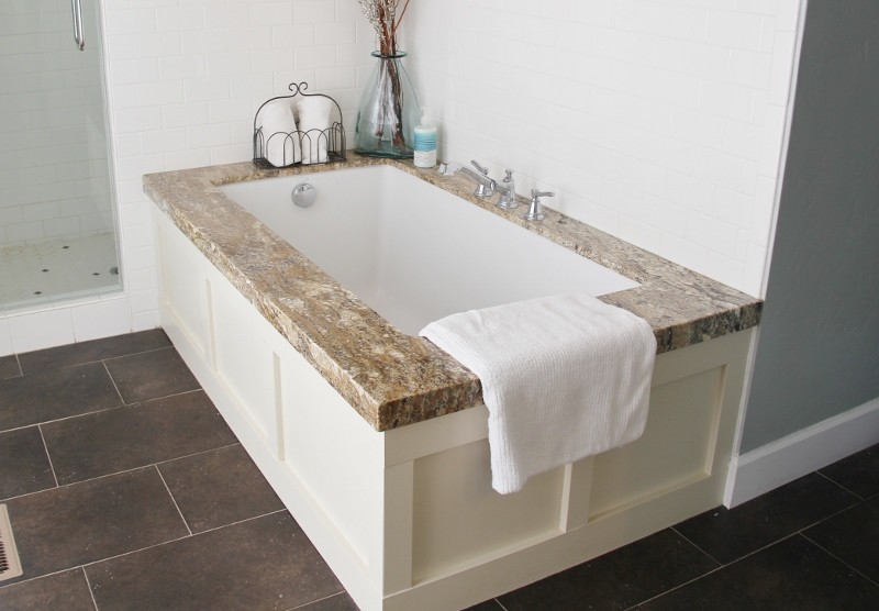 Bathroom - large craftsman brown tile and ceramic tile ceramic tile bathroom idea in Salt Lake City with an undermount sink, shaker cabinets, beige cabinets, granite countertops, an undermount tub and blue walls