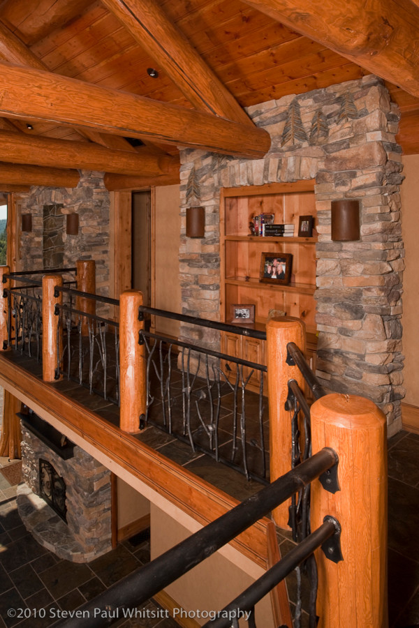 Hallway - large rustic slate floor hallway idea with beige walls