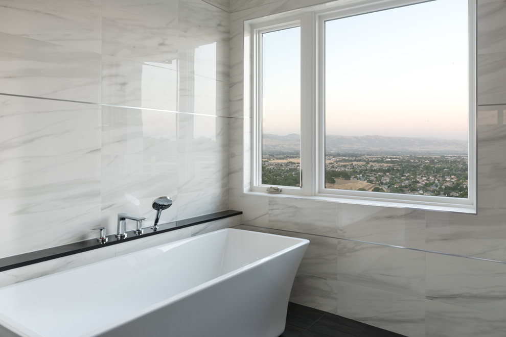 Design ideas for a large modern master bathroom in San Francisco with flat-panel cabinets, white cabinets, a freestanding tub, an open shower, gray tile, marble, grey walls, a vessel sink, engineered quartz benchtops, black floor, an open shower and black benchtops.