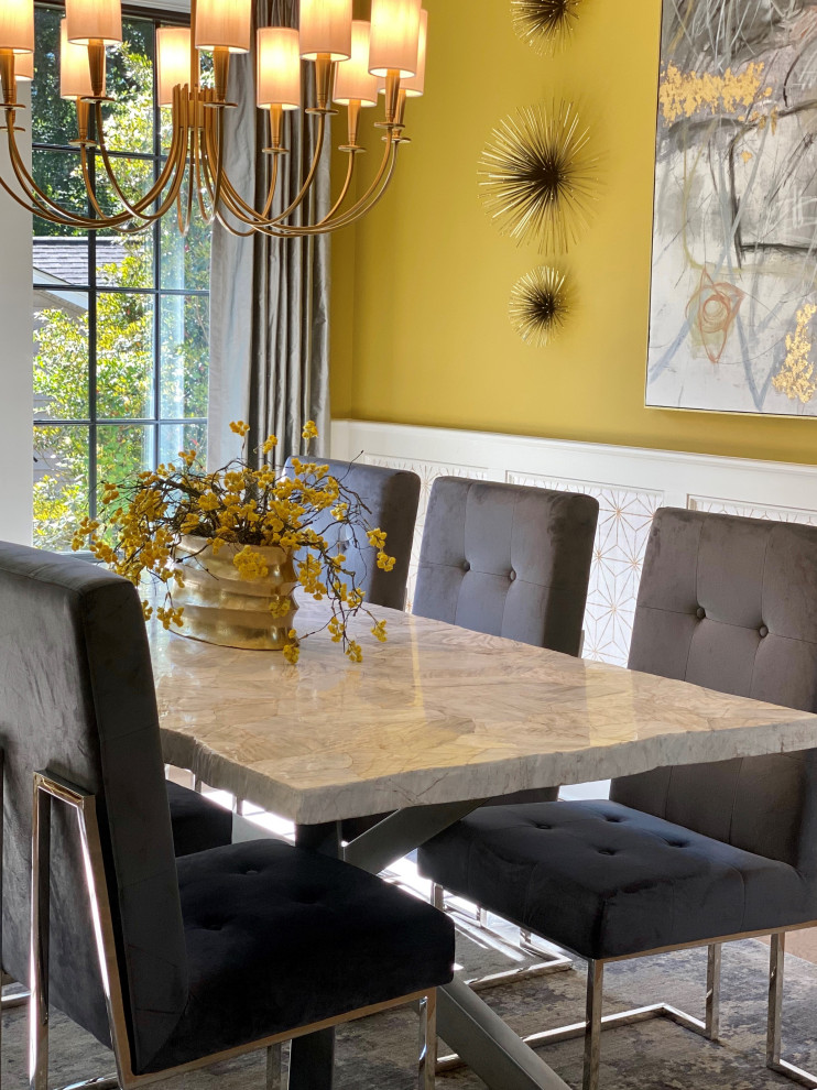This is an example of a mid-sized modern open plan dining in Charlotte with yellow walls, light hardwood floors, multi-coloured floor, recessed and wallpaper.