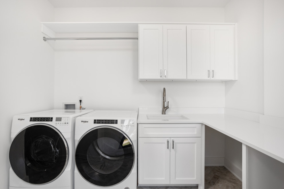 Dedicated laundry room - mid-sized transitional l-shaped terra-cotta tile and beige floor dedicated laundry room idea in Indianapolis with an undermount sink, shaker cabinets, white cabinets, quartz countertops, white walls, a side-by-side washer/dryer and multicolored countertops
