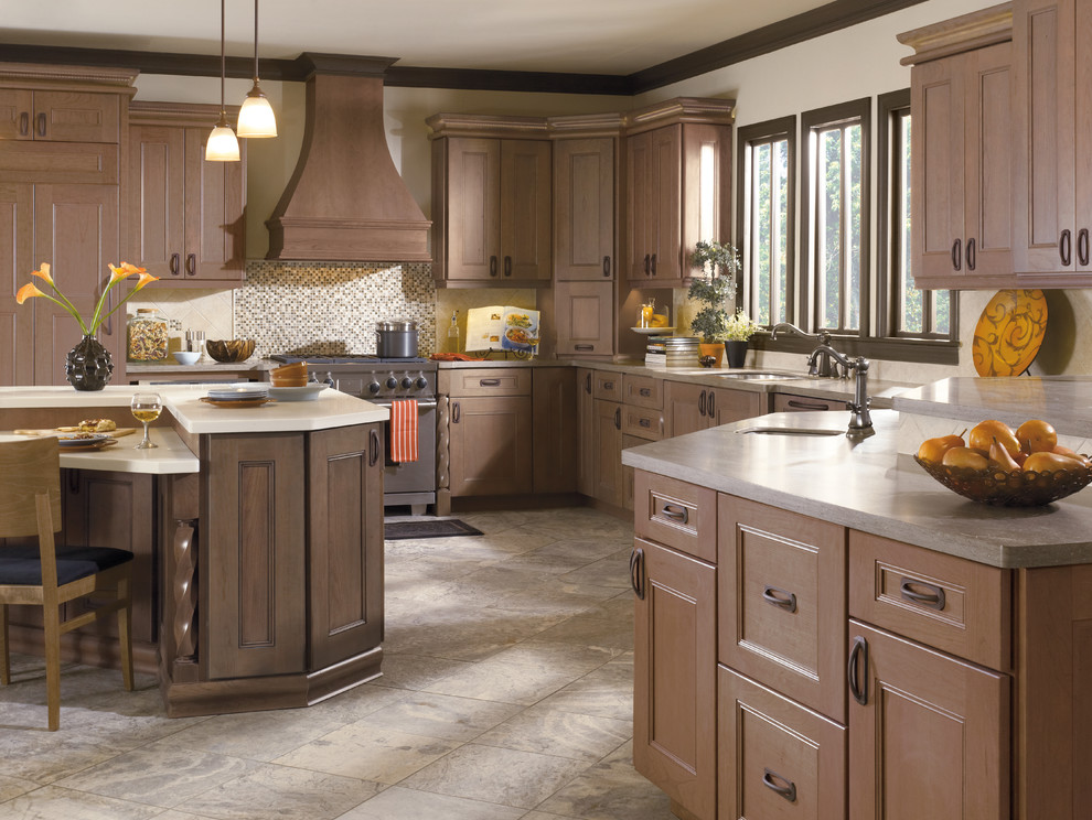 Eat-in kitchen - large transitional ceramic tile eat-in kitchen idea in Baltimore with medium tone wood cabinets, an island, a single-bowl sink, recessed-panel cabinets, laminate countertops, brown backsplash and stainless steel appliances