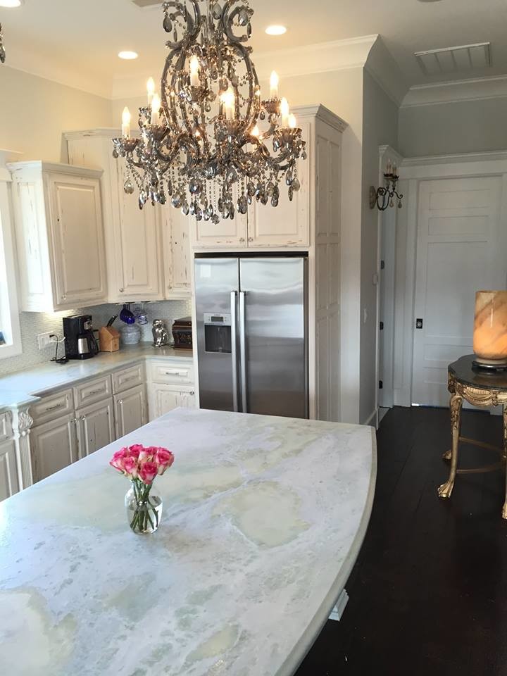 Inspiration for a large shabby-chic style l-shaped dark wood floor and brown floor eat-in kitchen remodel with an undermount sink, raised-panel cabinets, white cabinets, marble countertops, white backsplash, mosaic tile backsplash, stainless steel appliances and an island