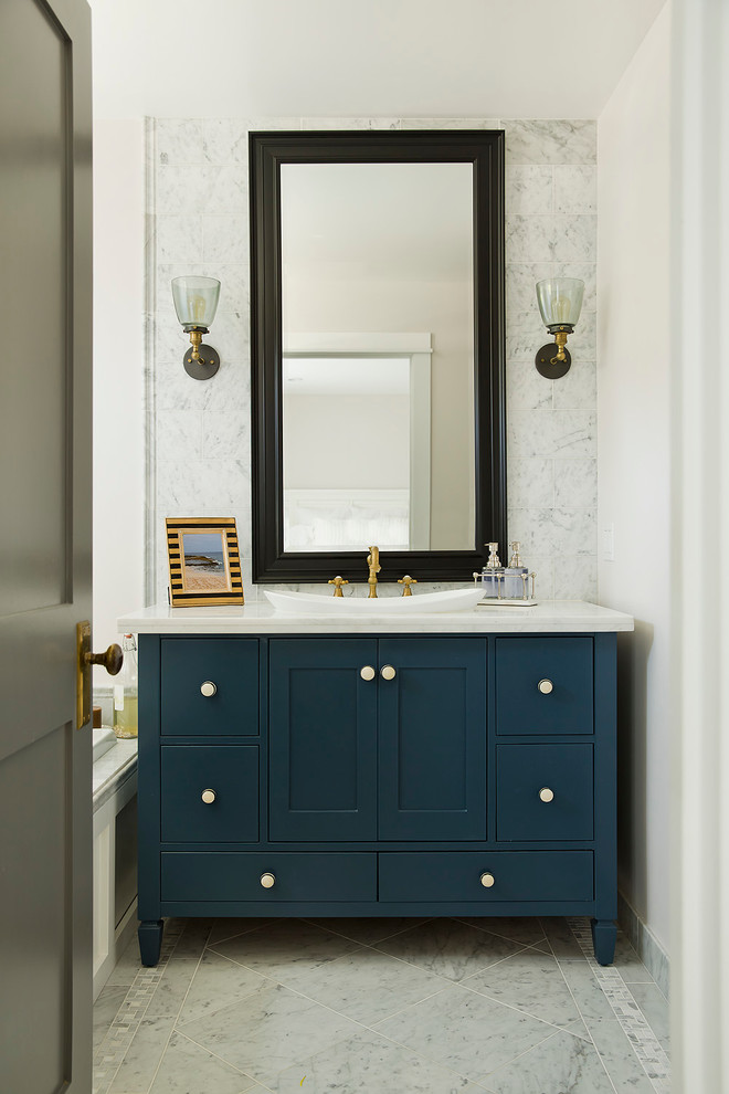 Inspiration for a beach style bathroom in Orange County with a drop-in sink, blue cabinets, white tile, white walls and flat-panel cabinets.