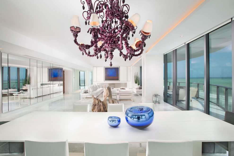 Design ideas for an expansive contemporary open plan dining in Miami with white walls, marble floors, a ribbon fireplace and a metal fireplace surround.
