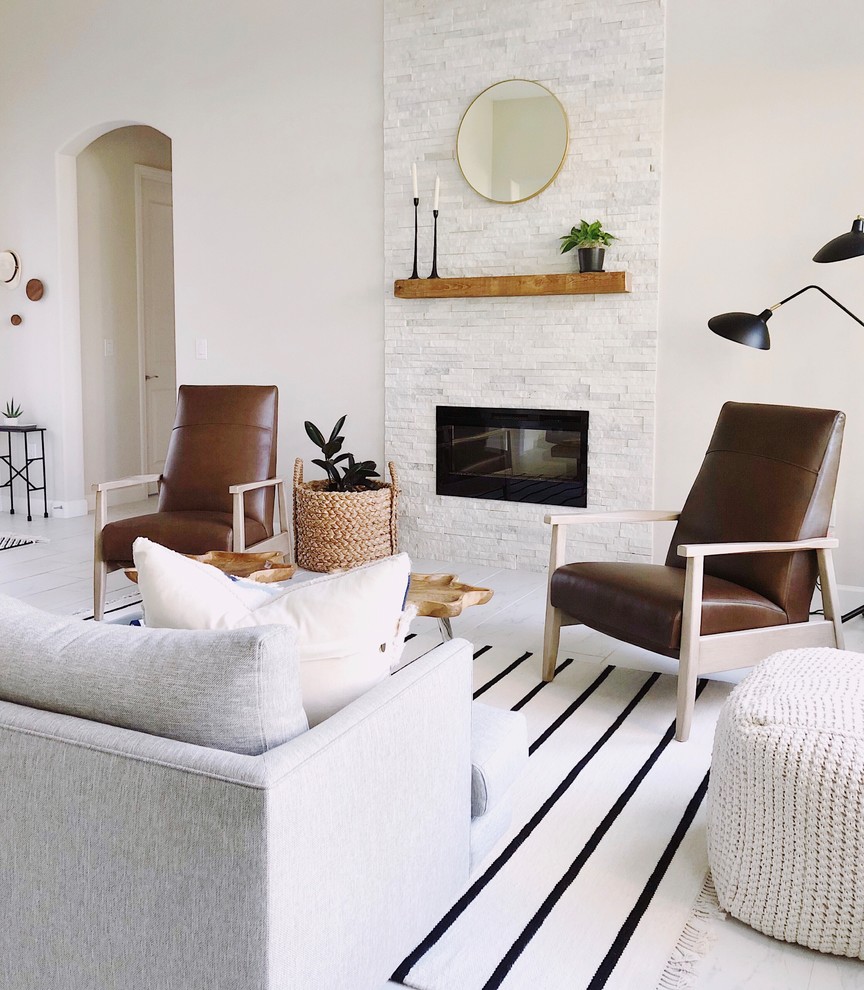Design ideas for a scandinavian living room in Orlando with beige walls, a ribbon fireplace, a stone fireplace surround and beige floor.