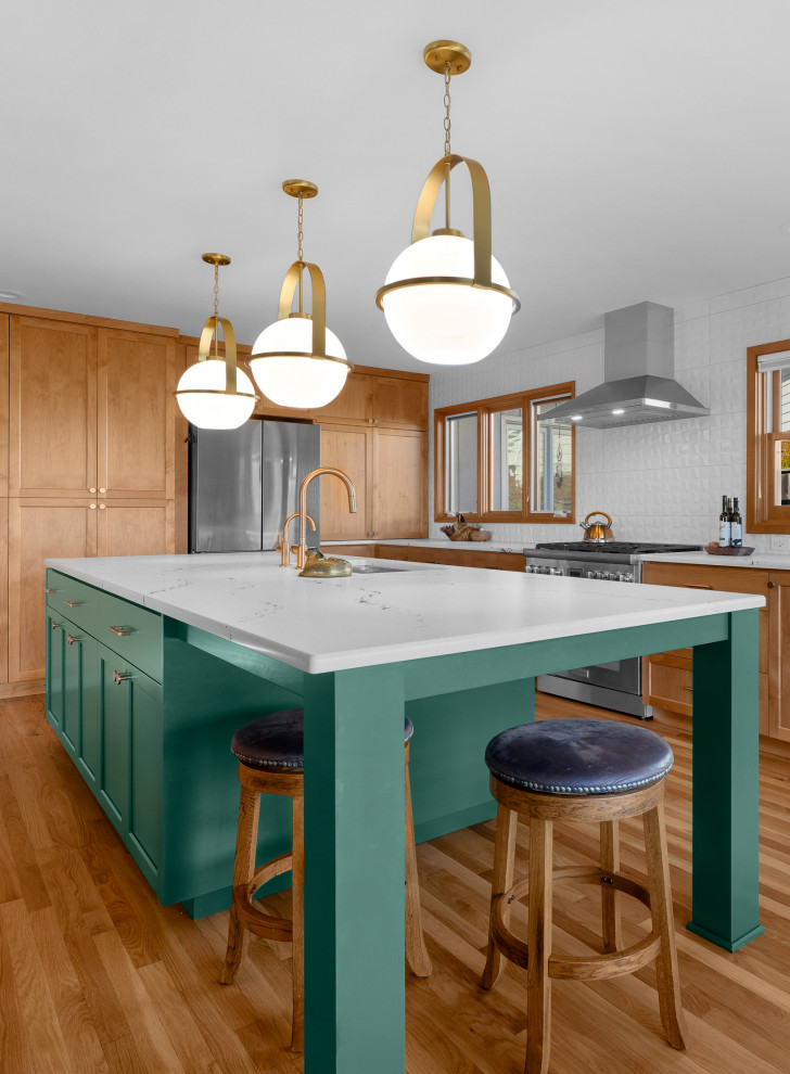 Kitchen - transitional l-shaped medium tone wood floor kitchen idea with shaker cabinets, white backsplash, an island and white countertops