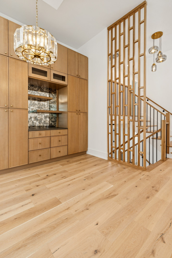 Custom Cabinetry with Vertical Screen Staircase & Statement Lighting