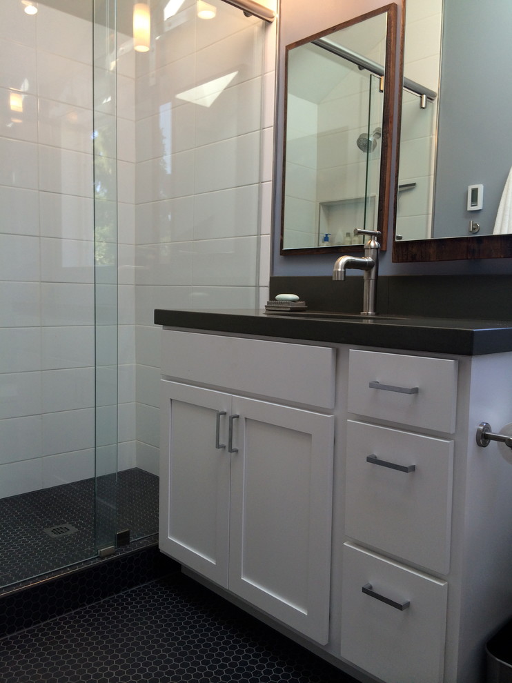 Inspiration for a small modern bathroom in Seattle with an integrated sink, shaker cabinets, white cabinets, concrete benchtops, an alcove shower, a two-piece toilet, white tile, ceramic tile, blue walls and porcelain floors.