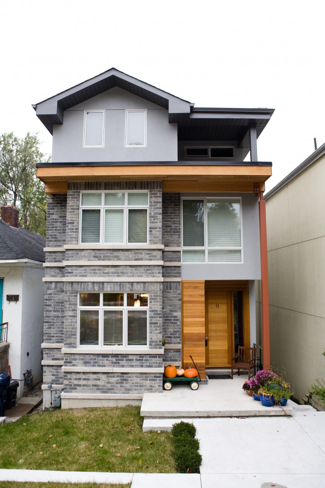 This is an example of a contemporary three-storey exterior in Toronto.
