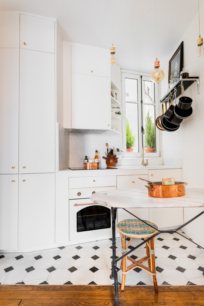 Design ideas for a small transitional single-wall open plan kitchen in Paris with an undermount sink, flat-panel cabinets, beige cabinets, marble benchtops, white splashback, marble splashback, white appliances, marble floors, no island, white floor and white benchtop.