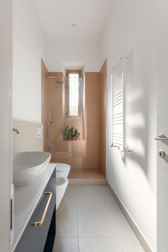 Medium sized contemporary shower room bathroom in Milan with blue cabinets, a walk-in shower, a two-piece toilet, multi-coloured tiles, porcelain tiles, multi-coloured walls, a vessel sink, an open shower, white worktops, a single sink and a freestanding vanity unit.