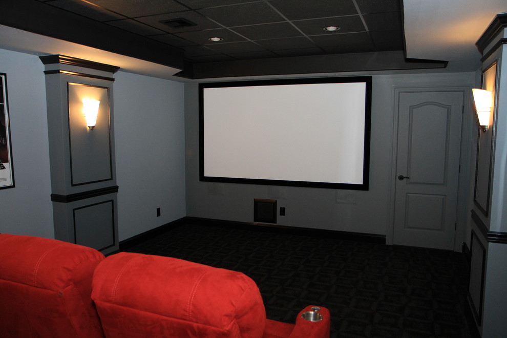 Inspiration for an expansive transitional home theatre in Philadelphia with blue walls and carpet.