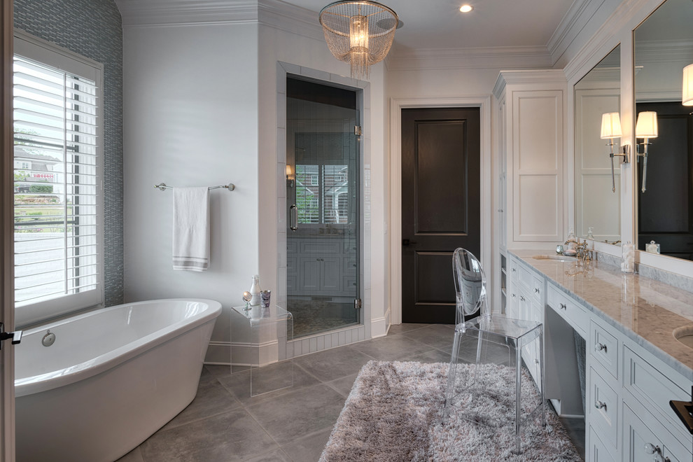Inspiration for a large transitional kids' freestanding bathtub remodel with beaded inset cabinets, gray cabinets, quartz countertops and a hinged shower door