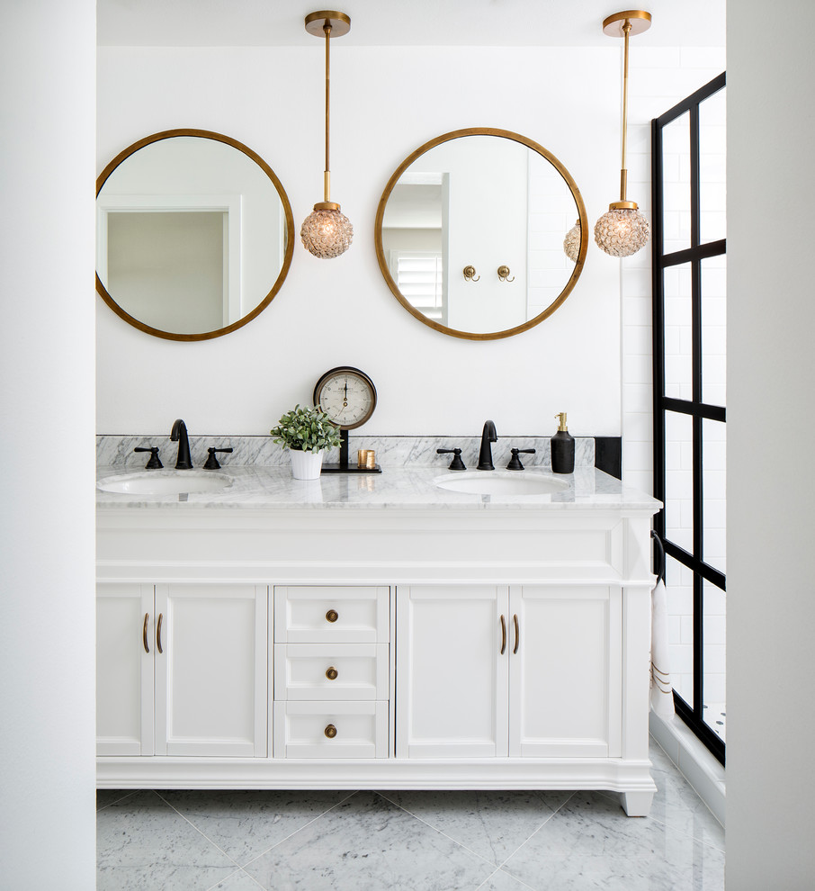 Inspiration for a mid-sized traditional bathroom in San Francisco with white cabinets, white walls, an undermount sink, recessed-panel cabinets, a two-piece toilet, white tile, subway tile, marble floors, marble benchtops and an alcove shower.