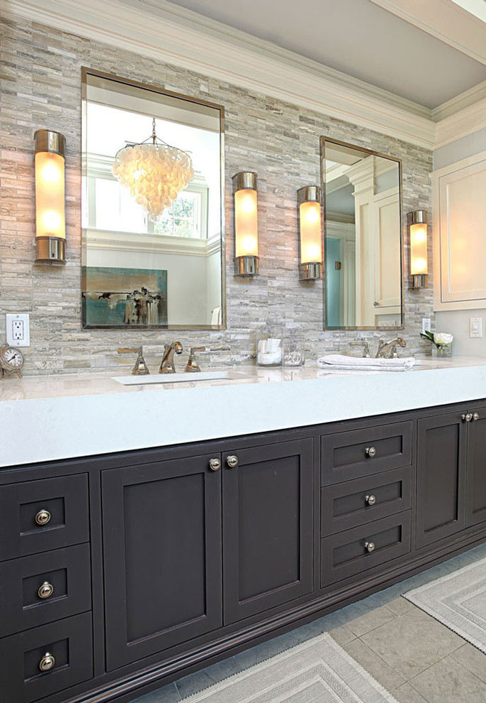 Inspiration for a mid-sized transitional master bathroom in New York with an undermount sink, shaker cabinets, black cabinets, gray tile, grey walls, marble benchtops and stone tile.