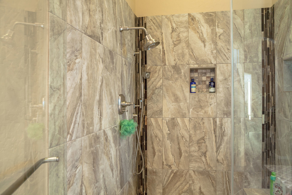Home design - mid-sized transitional master brown tile and porcelain tile porcelain tile home design idea in Phoenix with recessed-panel cabinets, brown cabinets, beige walls, an undermount sink and quartz countertops