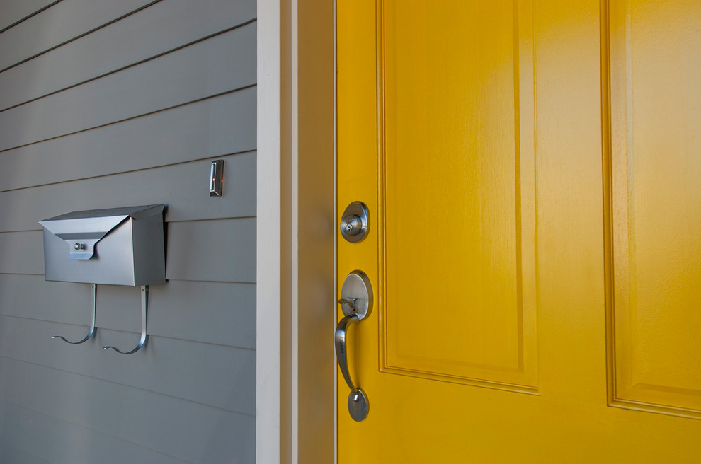 Entryway - small contemporary entryway idea in Vancouver with gray walls and a yellow front door