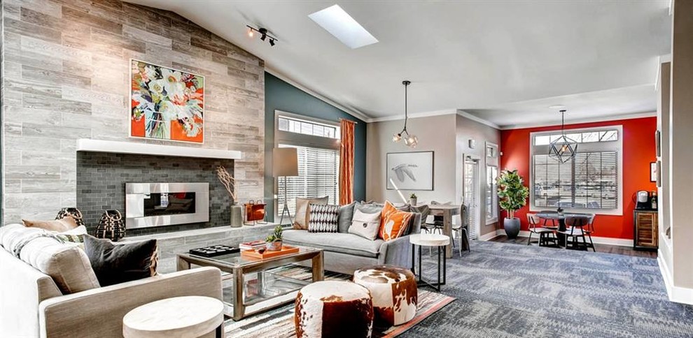 Inspiration for a large transitional formal open concept living room in Denver with orange walls, carpet, a ribbon fireplace, a tile fireplace surround, no tv and blue floor.