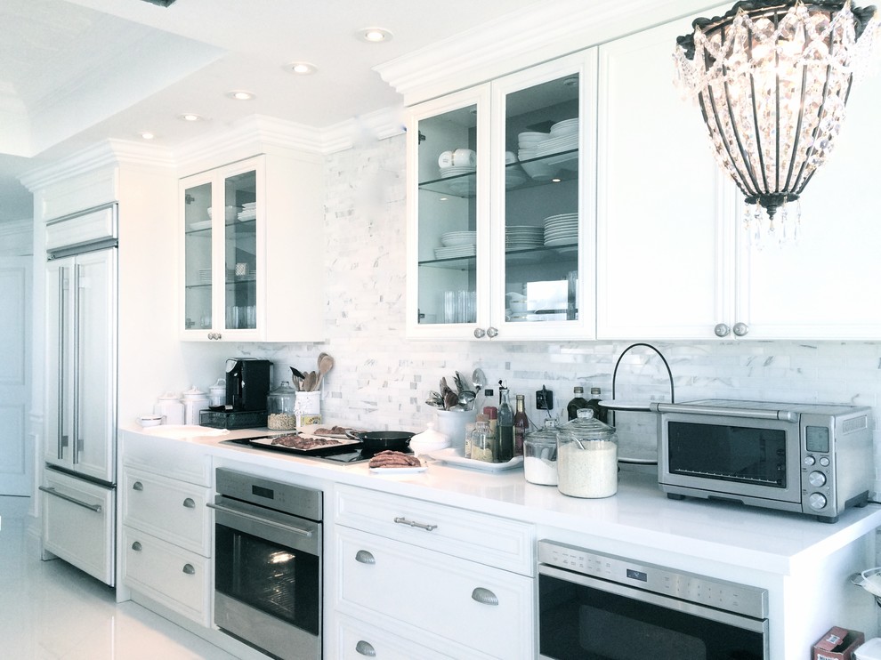 Expansive contemporary galley eat-in kitchen in Other with an undermount sink, shaker cabinets, light wood cabinets, quartzite benchtops, white splashback, subway tile splashback, stainless steel appliances, porcelain floors and with island.