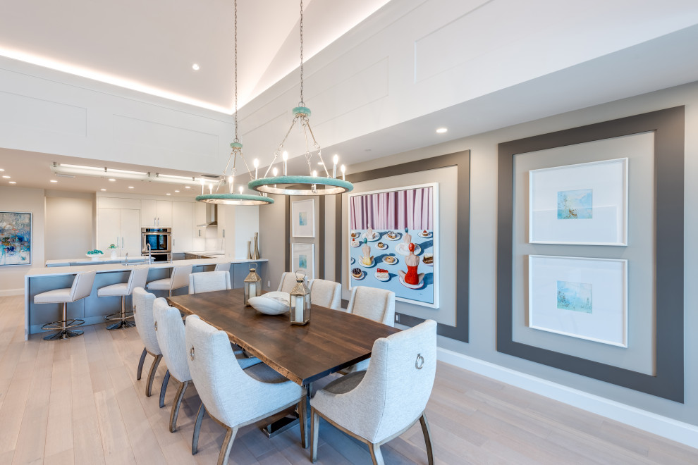Design ideas for a contemporary open plan dining in Miami with grey walls, light hardwood floors, beige floor and vaulted.