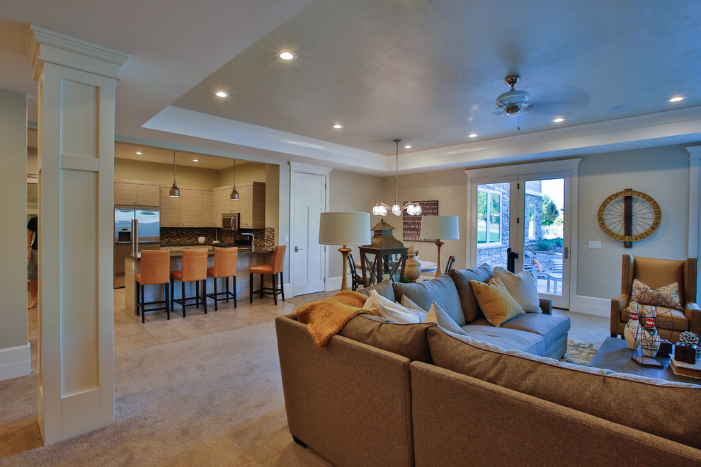 This is an example of a large transitional walk-out basement in Salt Lake City with beige walls and carpet.