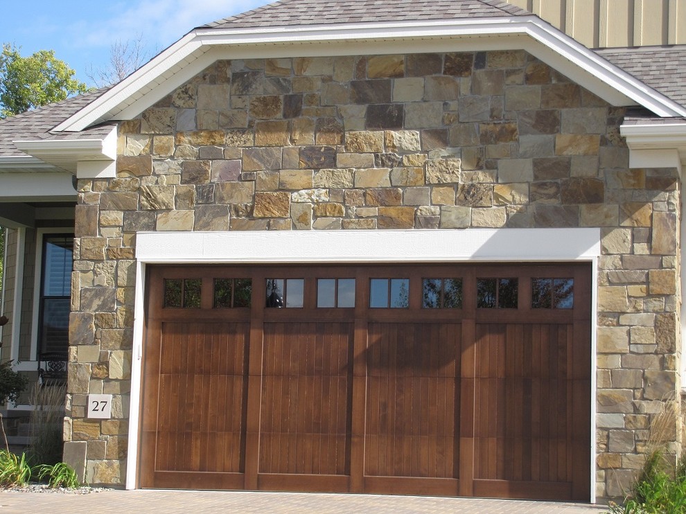 Photo of a traditional attached two-car garage in Other.