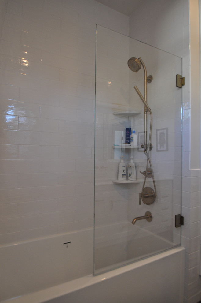 Photo of a medium sized traditional family bathroom in Boston with an alcove bath, an alcove shower, white tiles, white walls, marble worktops, an open shower, white worktops and wainscoting.