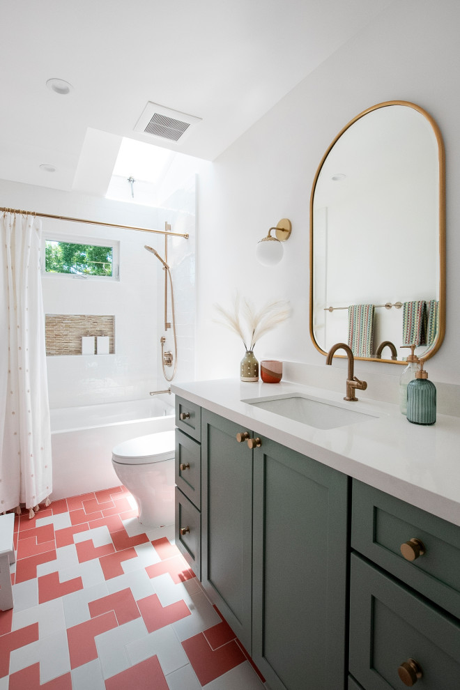 Photo of a medium sized classic family bathroom in San Francisco with shaker cabinets, green cabinets, an alcove bath, a shower/bath combination, a one-piece toilet, white tiles, porcelain tiles, white walls, porcelain flooring, a submerged sink, engineered stone worktops, pink floors, a shower curtain, white worktops, a single sink and a built in vanity unit.