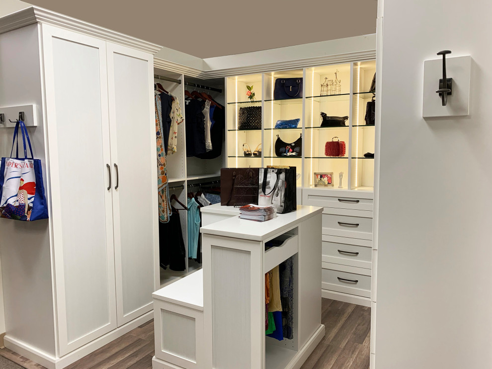 Inspiration for a contemporary walk-in wardrobe for women in Philadelphia with shaker cabinets and white cabinets.