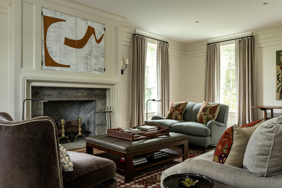 This is an example of a country living room in New York with beige walls and a standard fireplace.