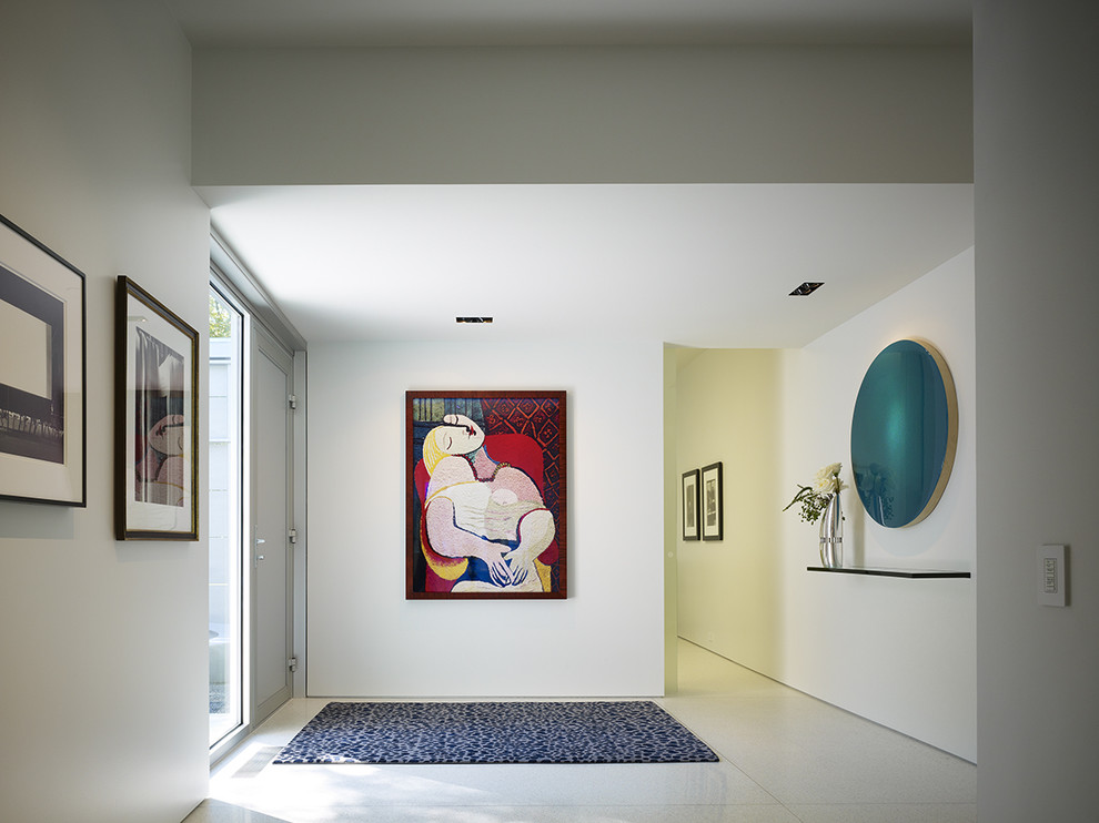 Photo of a contemporary entryway in Chicago with white walls.