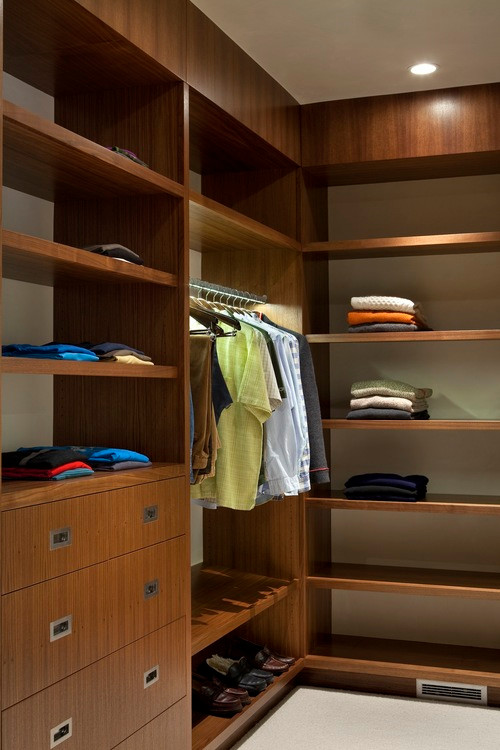 Built-in closet - mid-sized contemporary carpeted built-in closet idea in Denver