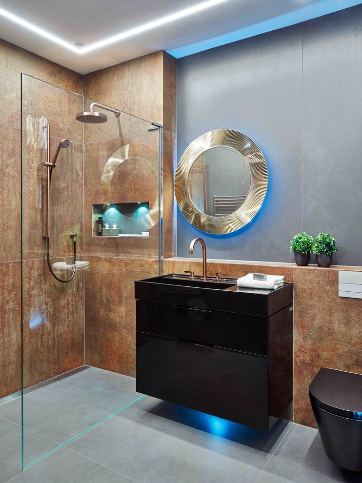 Photo of a small contemporary 3/4 wet room bathroom in Devon with a wall-mount toilet, porcelain tile, flat-panel cabinets, black cabinets, a wall-mount sink, grey floor, an open shower, black benchtops, porcelain floors and brown walls.