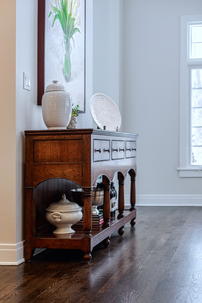 Example of a large transitional u-shaped dark wood floor and brown floor eat-in kitchen design in Chicago with a farmhouse sink, beaded inset cabinets, white cabinets, quartz countertops, gray backsplash, glass tile backsplash, stainless steel appliances, an island and white countertops