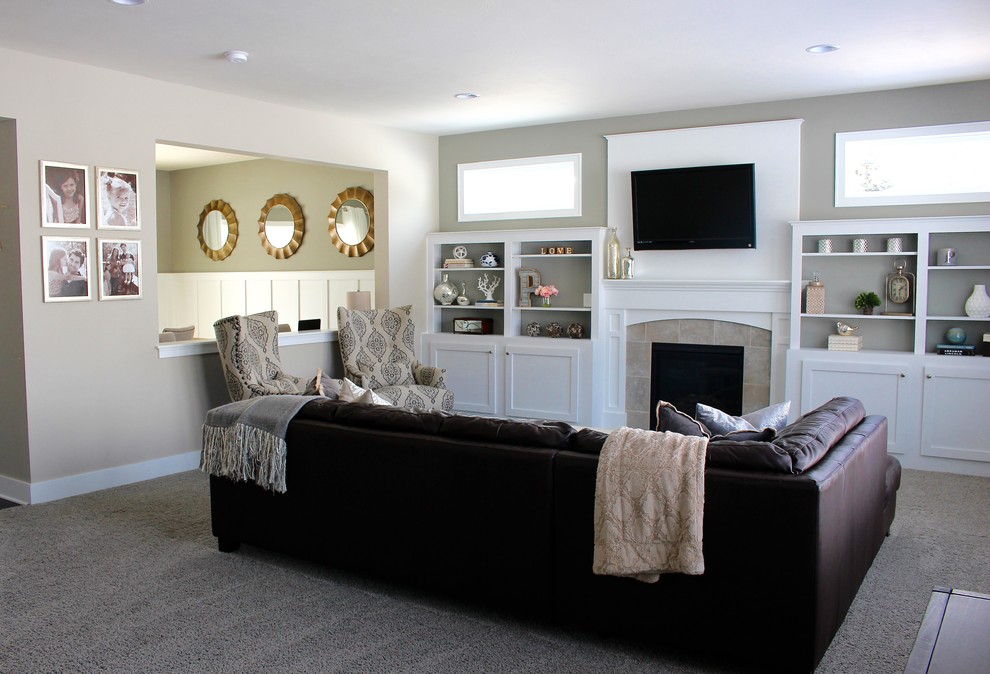 This is an example of a large transitional open concept family room in Grand Rapids with carpet, a standard fireplace, a tile fireplace surround and a built-in media wall.