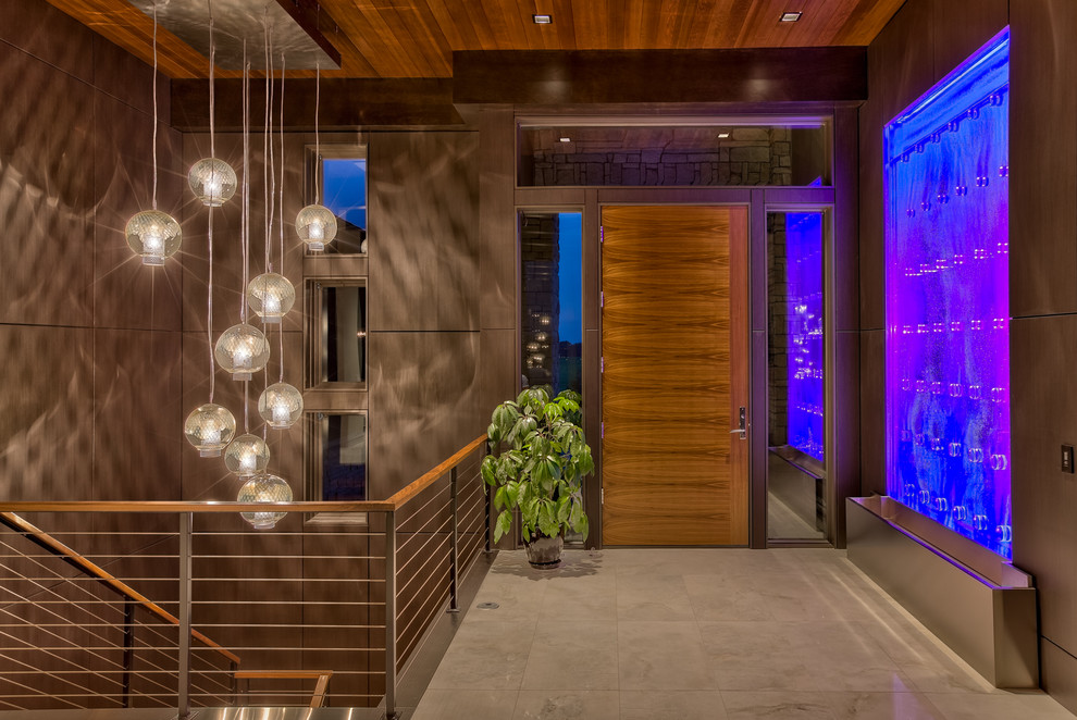 Contemporary entryway in Omaha with ceramic floors, a single front door, a medium wood front door and beige floor.