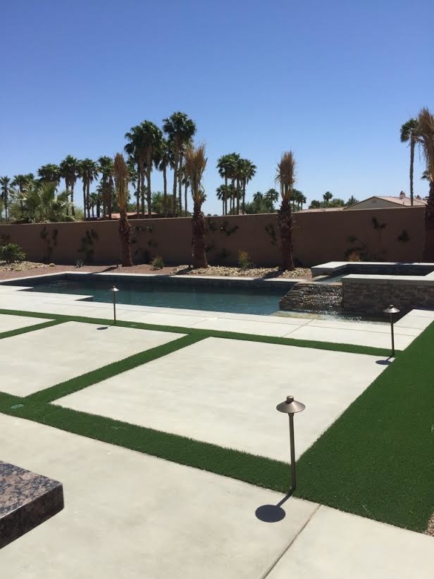 Example of a mid-sized backyard concrete paver hot tub design