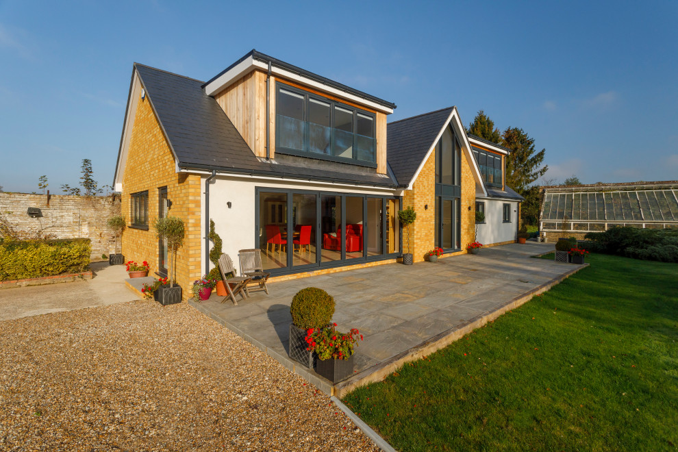 Photo of a mid-sized contemporary home design in Kent.