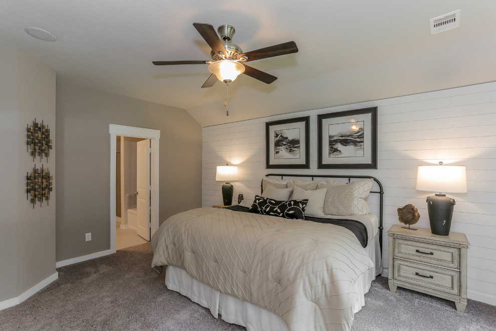 This is an example of a mid-sized traditional master bedroom in Houston with beige walls, carpet and beige floor.