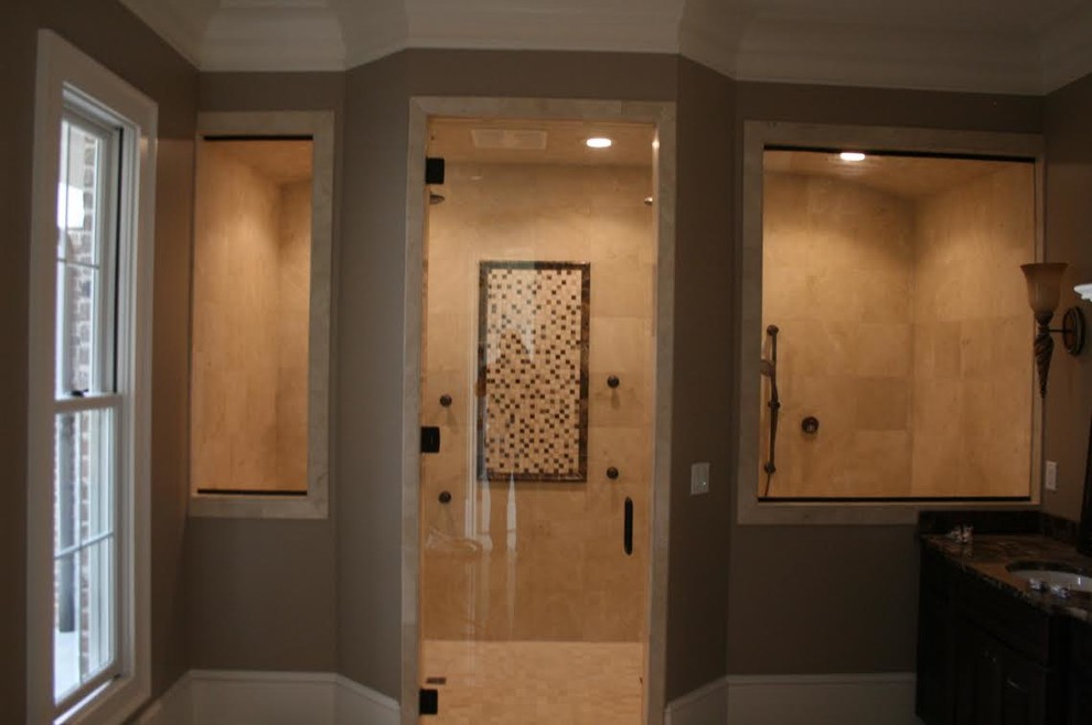 Inspiration for a large transitional master beige tile and ceramic tile alcove shower remodel with a hinged shower door
