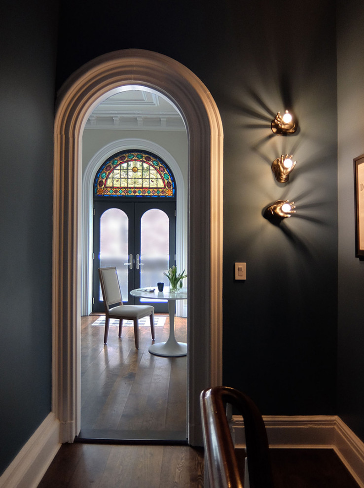 Inspiration for a transitional hallway in New York with grey walls, dark hardwood floors and brown floor.